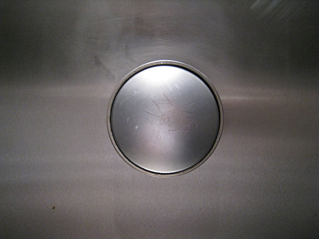 Le bouton de la chasse d'eau